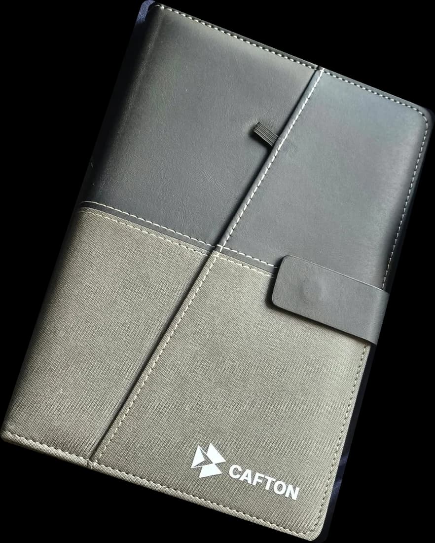 Black and grey Cafton notebook with the logo on the cover