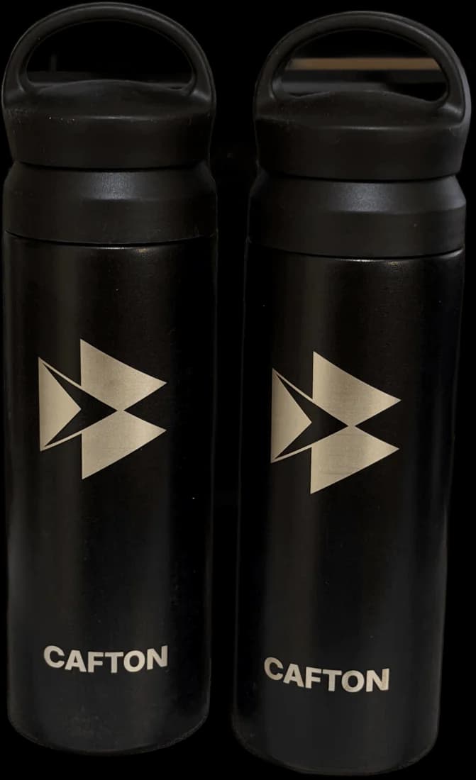 Two black Cafton tumblers with the engraved logo